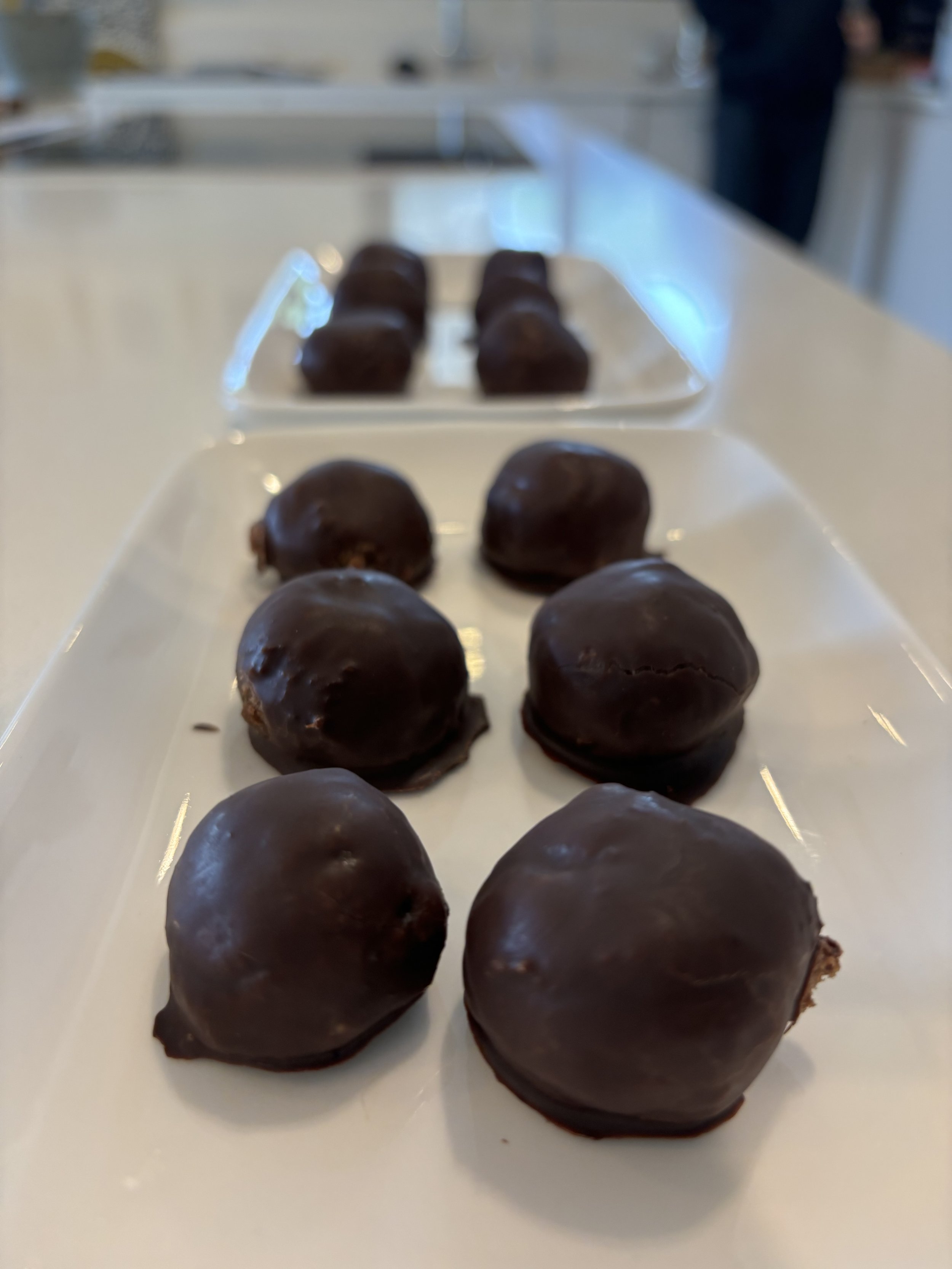 Dark Chocolate Rocher Energy Balls
  Date and nut energy balls finished with a dark chocolate coating.