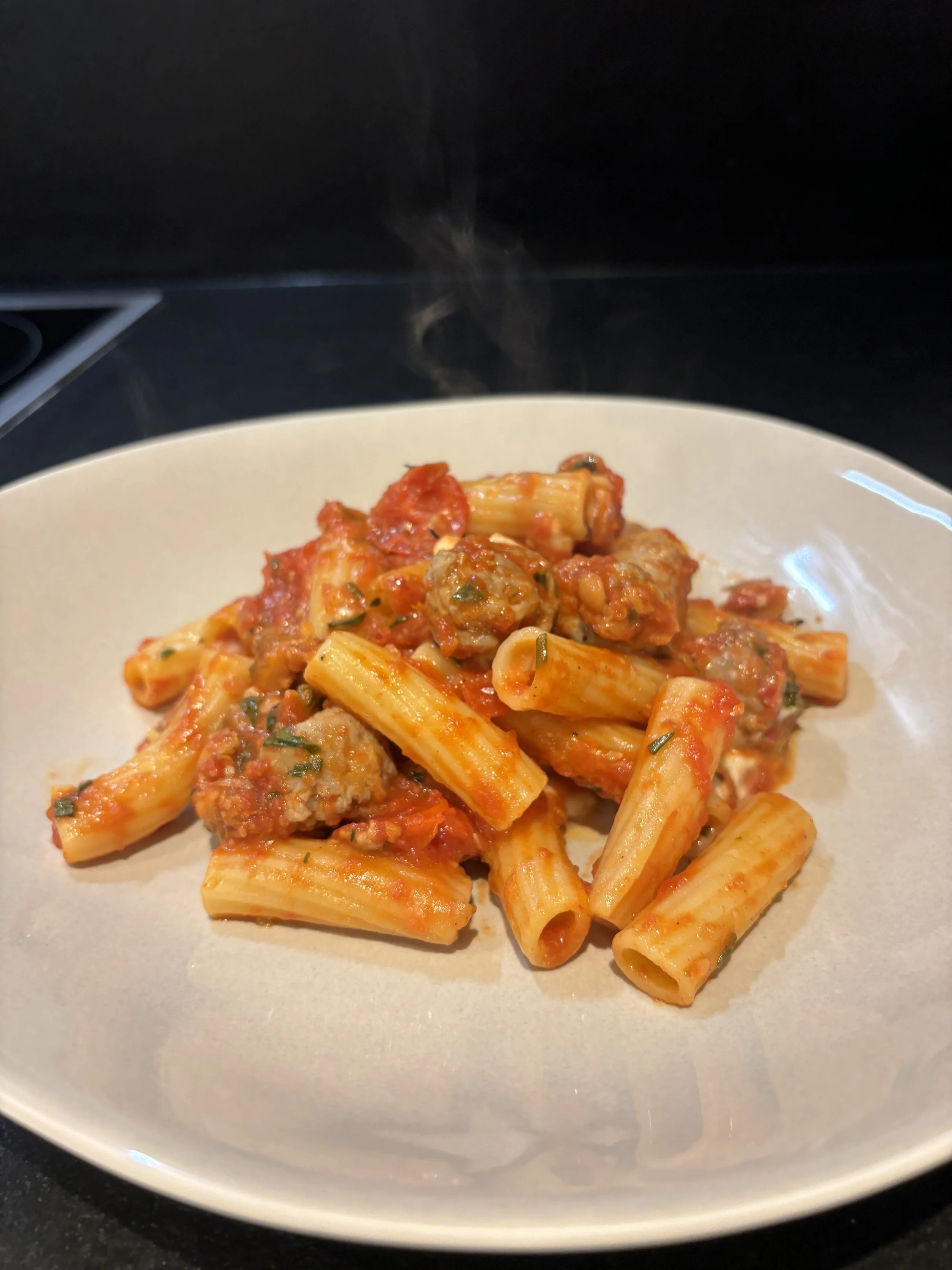 Rigatoni with Italian Sausage and Tomato
  Rigatoni tossed with Italian sausage in rich tomato sauce, finished with fresh herbs and extra-virgin olive oil.