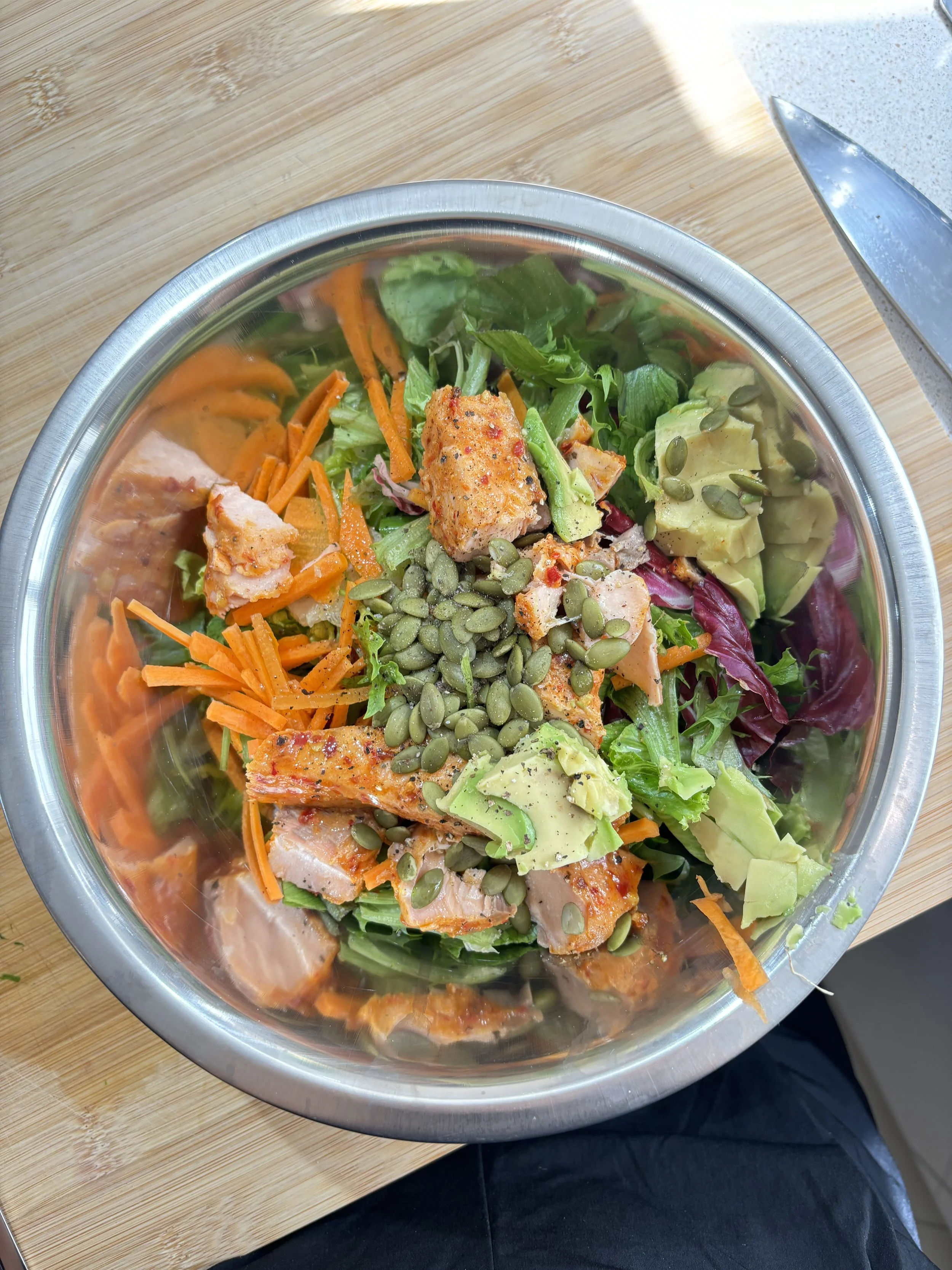 Spiced Salmon and Avocado Garden Salad
  Seared spiced salmon served over mixed seasonal greens with avocado, shaved carrot, toasted pumpkin seeds, and extra-virgin olive oil.