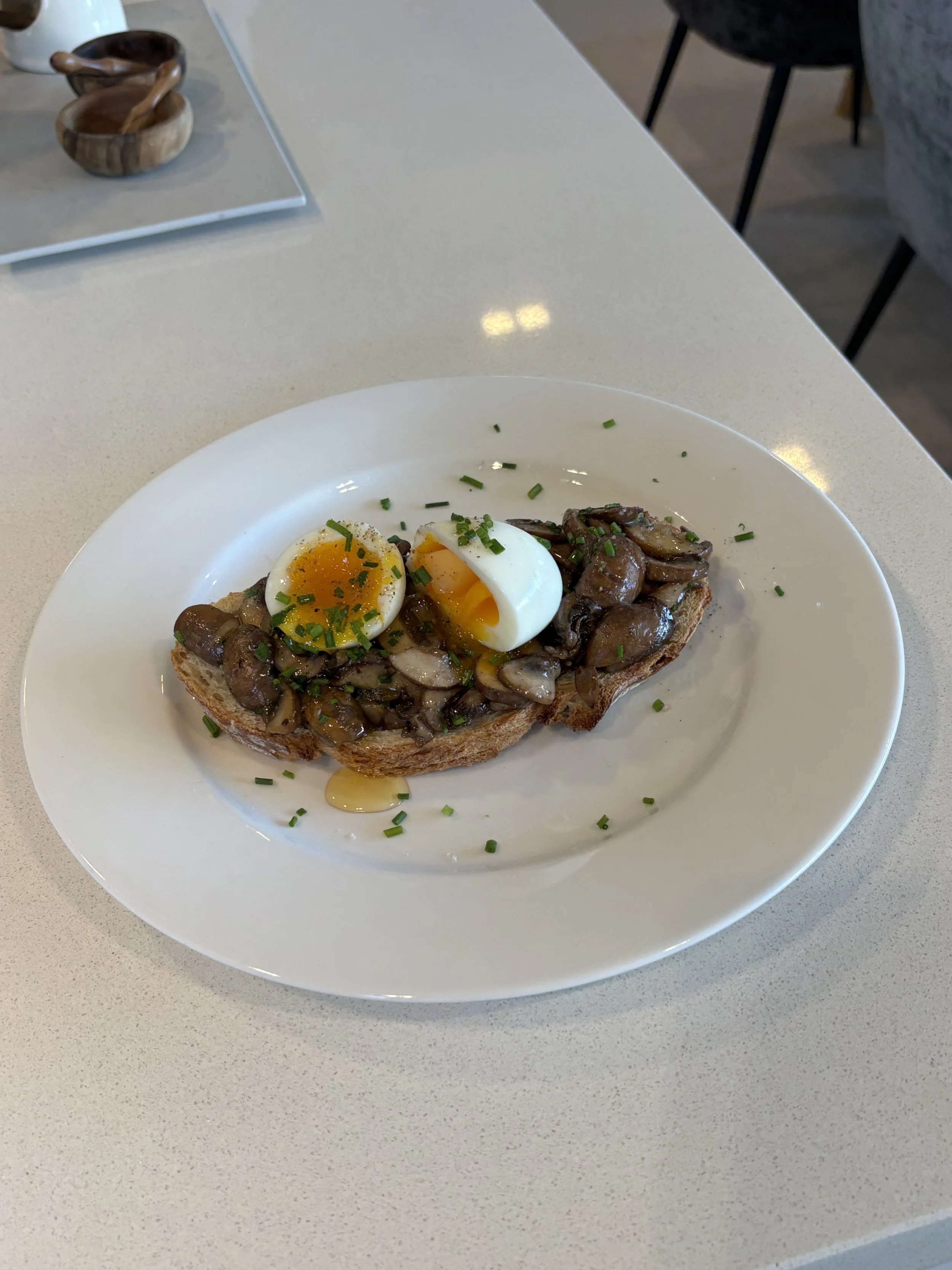 Garlic-Infused Wild Mushrooms and Soft-Boiled Egg on Sourdough
  Garlic-infused wild mushrooms served on toasted sourdough with soft-boiled egg and fresh chives.