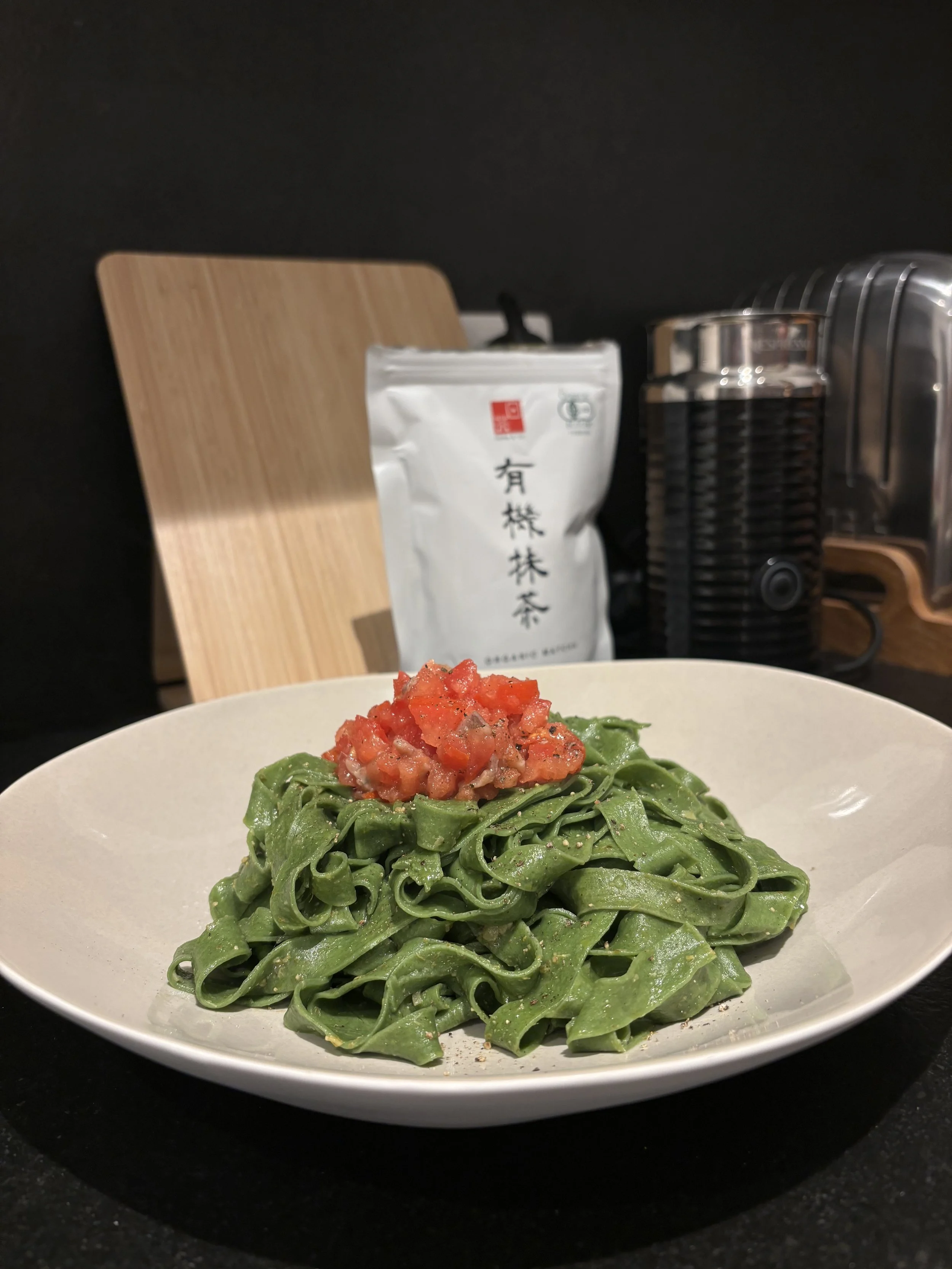 Handcrafted Spinach Tagliatelle with Fresh Tomato Relish  House-made spinach tagliatelle lightly dressed in garlic-infused olive oil, topped with fresh tomato relish, and finished with cracked black pepper.