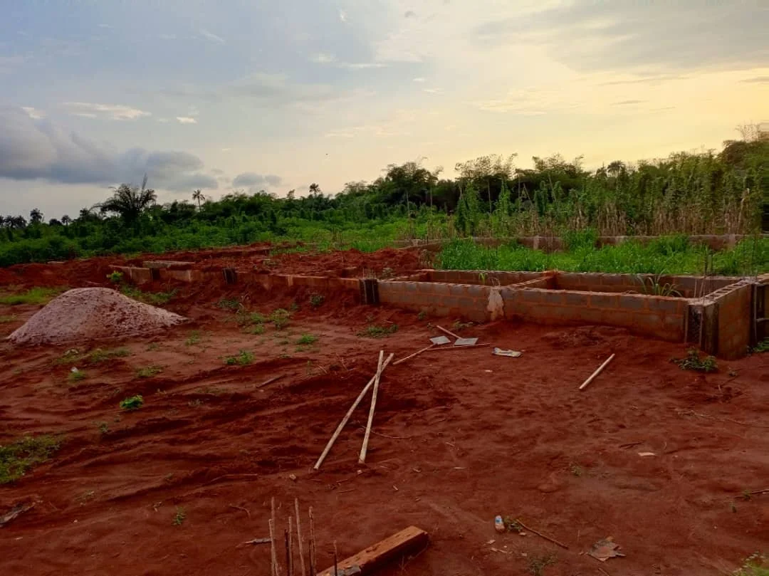 The laboratory block still at foundation level because of the swampy soil and rain that  hampered movement of the materials too close to it.