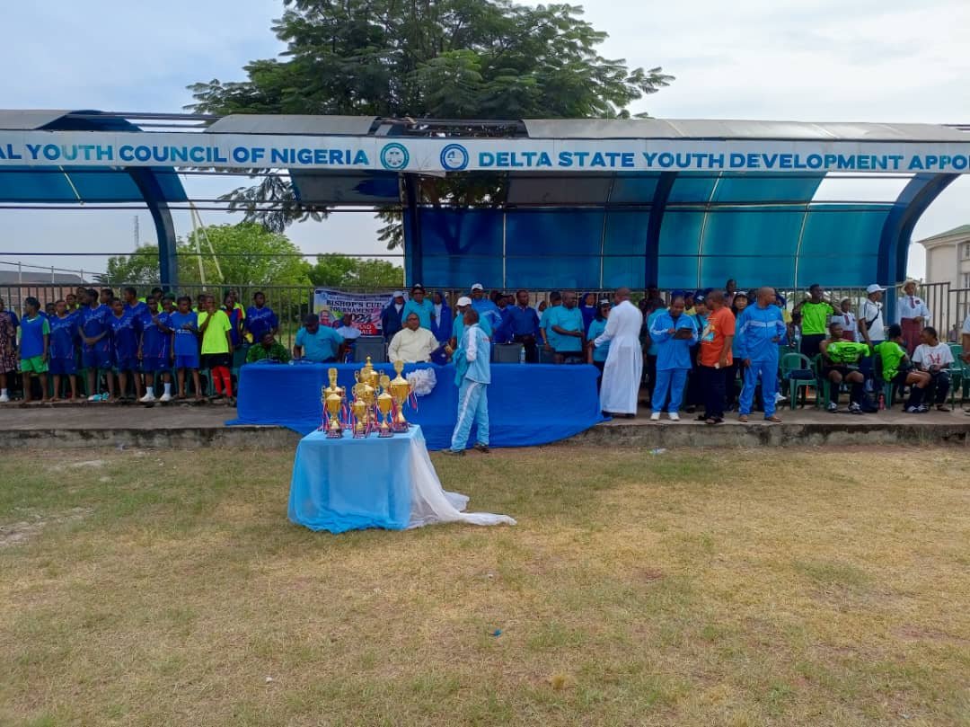 Female_Football_Team_At_Event_Stand.jpg