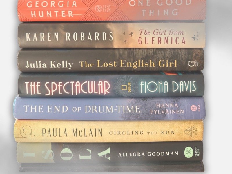 A stack of emotional fiction books that made me cry in 2025, including Circling the Sun and A Twilight in Paris