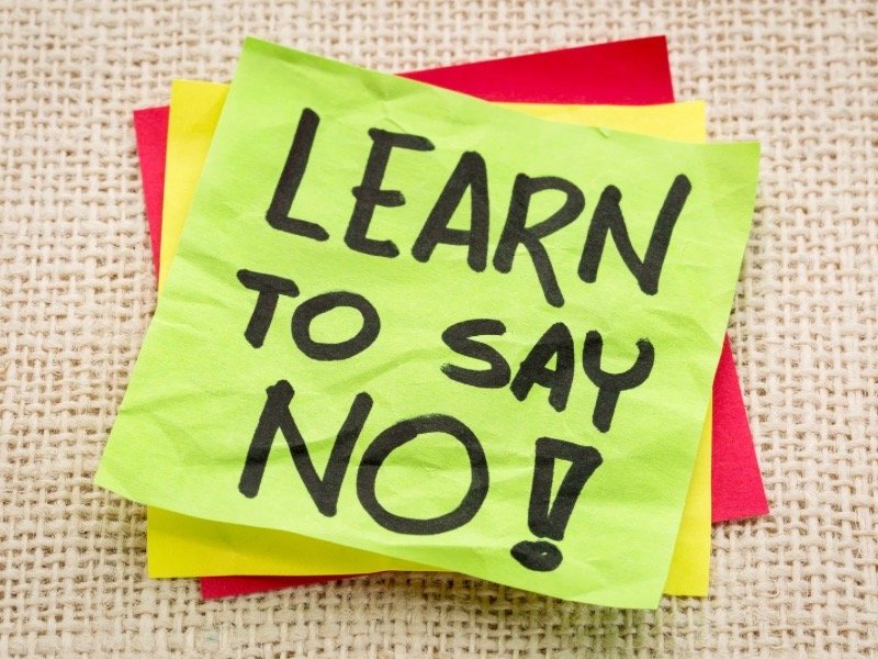 A bright sticky note with the words ‘Learn to Say No,’ promoting boundary-setting and inner self-care micro-habits for 2026.
