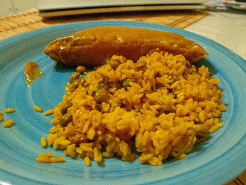 Holiday tamales served with arroz con gandule, for a festive meal.