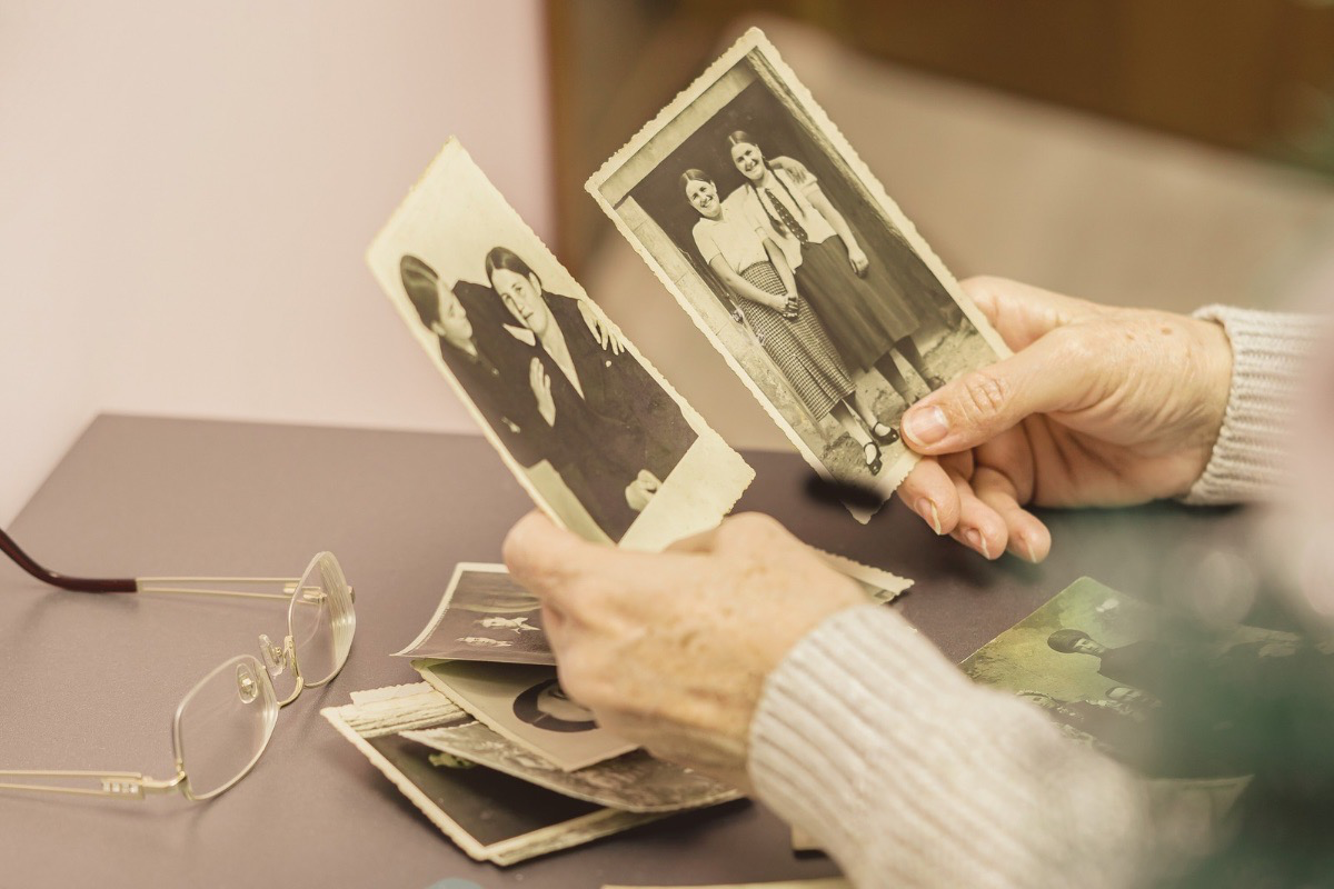 Old photographs representing generational trauma and inherited family dynamics