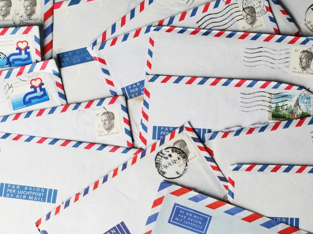 Stack of vintage airmail letters, representing how memory and friendship are preserved through correspondence in The Women by Kristin Hannah