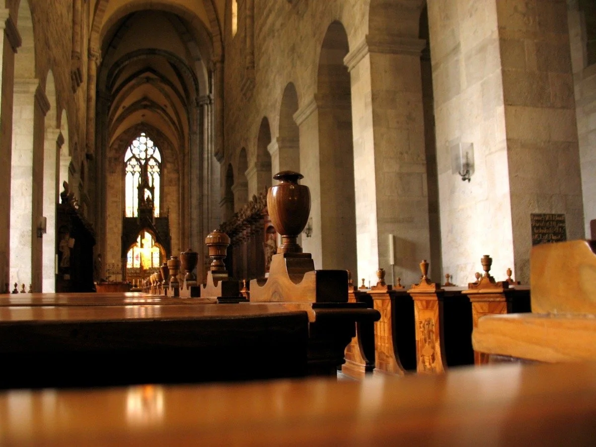 Quiet church interior symbolizing religion, silence, and emotional repression in LGBTQ film narratives.