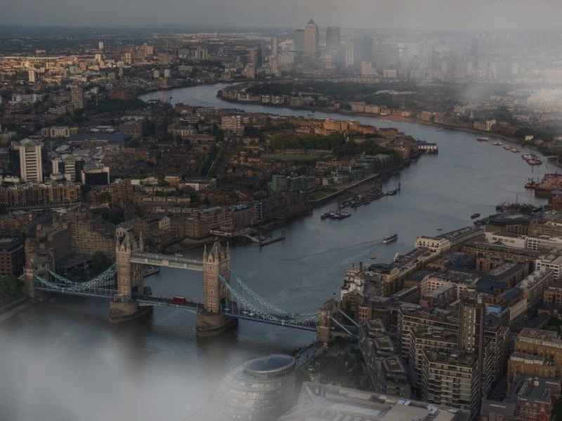 Aerial photo of London featuring Tower Bridge and the River Thames, evoking the historical and atmospheric backdrop connected to themes in The Secret Book of Flora Lea.