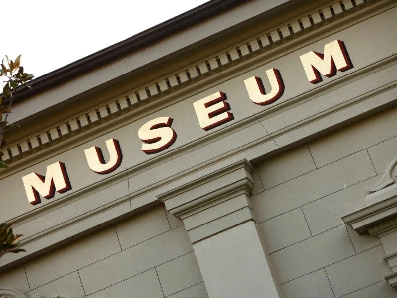 Close-up of a museum building facade with bold lettering reading ‘MUSEUM,’ representing the classic elegance behind museum-inspired art and decor.