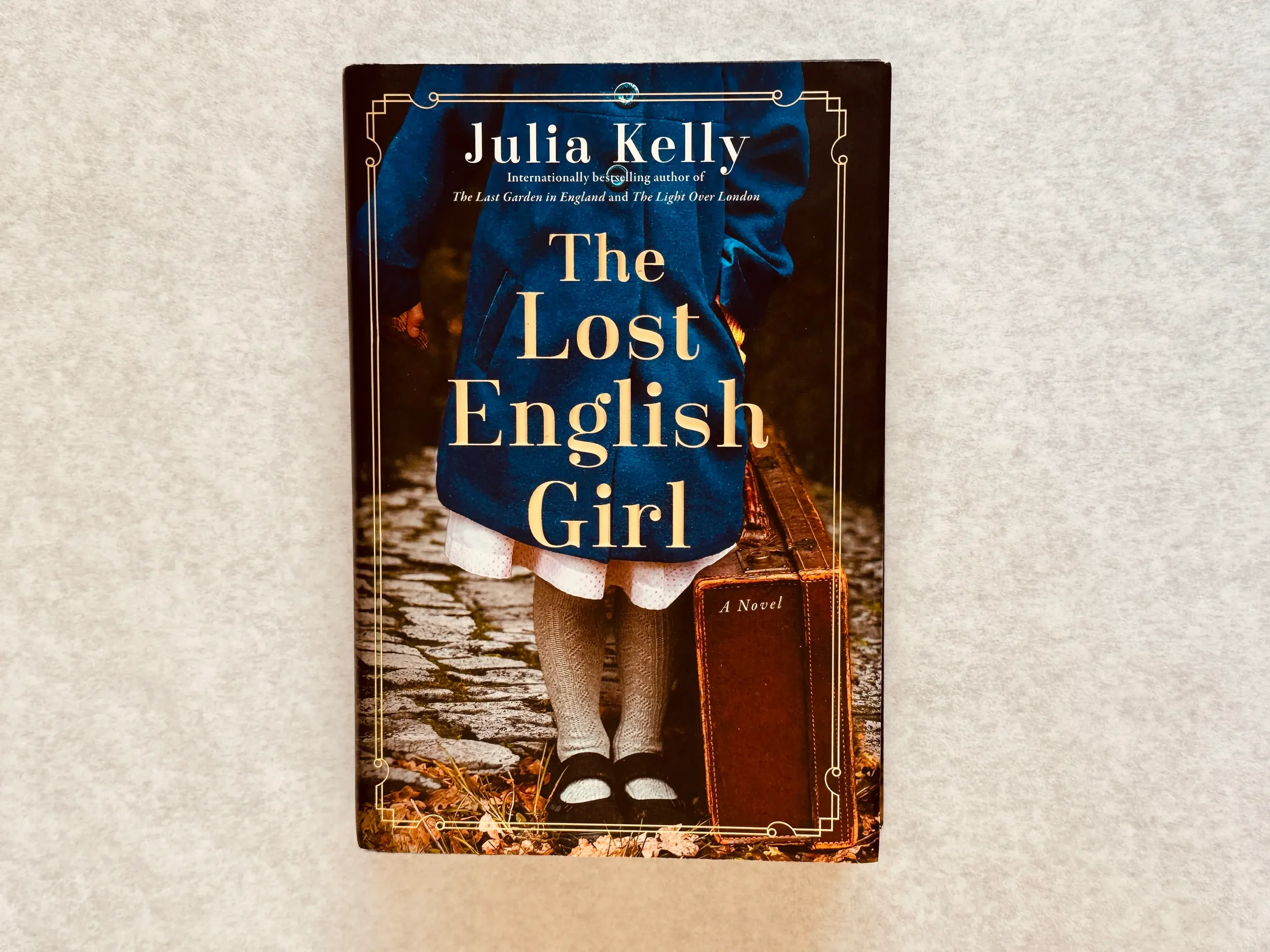 The Lost English Girl by Julia Kelly book cover. Accompanying She The King  August book pick