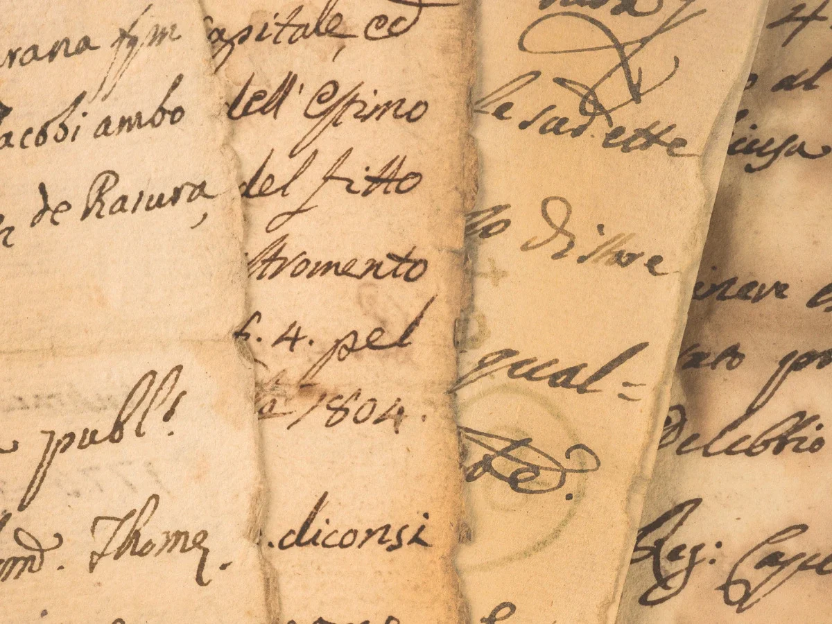 Overlapping antique handwritten letters in cursive ink, layered and worn at the edges—used to open "The Desire We Keep Calling Impractical," an essay on editing our wants before naming them, on She The King.