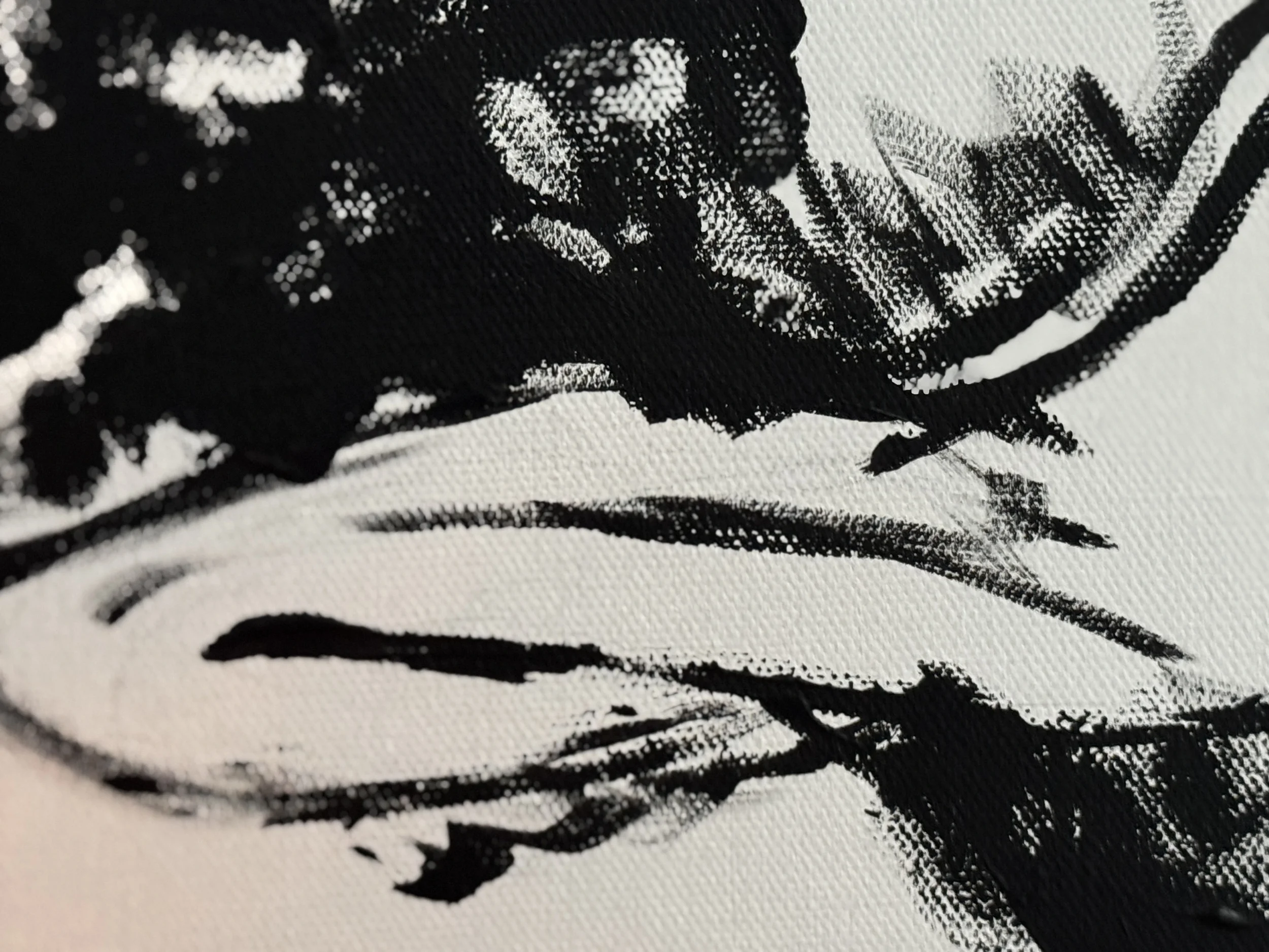 Close-up of bold black brushwork on white canvas — raw mark-making evoking the witness-bearing quality of art that meets grief without resolving it