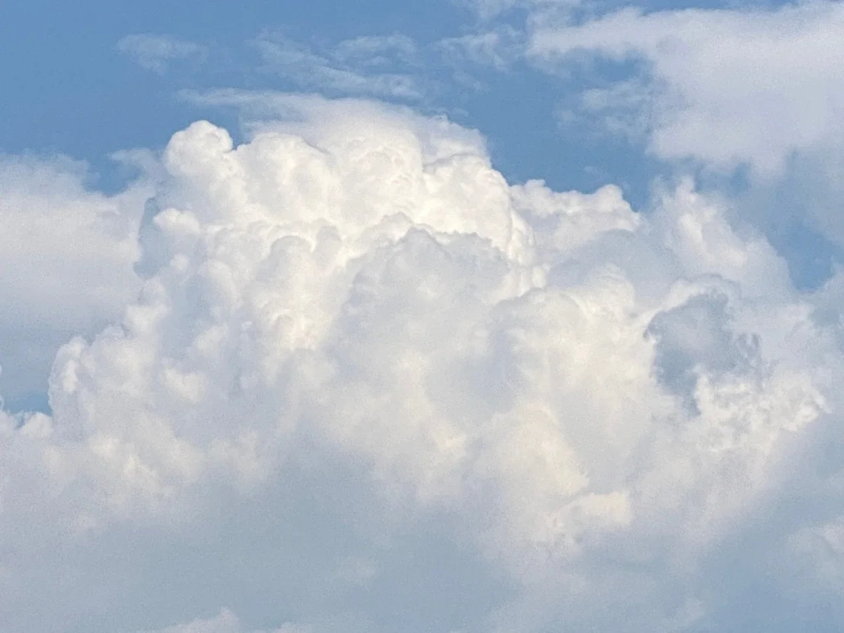 A close-up study of a cumulus cloud against blue sky, echoing the patient cloud studies John Constable painted throughout his career.
