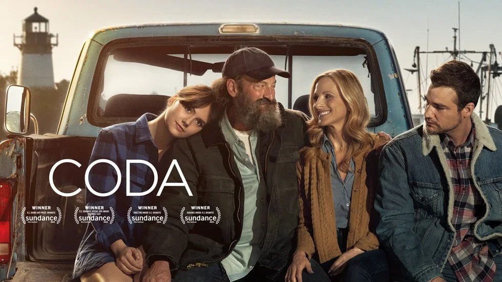 Promotional poster for the film CODA showing members of a deaf family making the sign for “I love you,” highlighting themes of communication, identity, and family connection.
