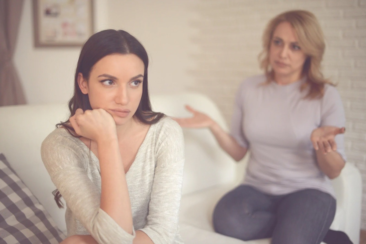 Mother and daughter in tense conversation - dysfunctional family dynamics explored in literary fiction