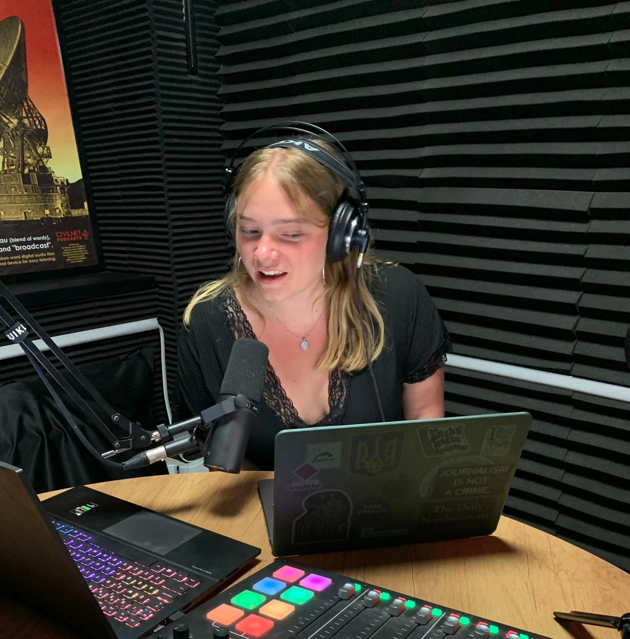 Young woman at an office with a headphone and using a microphone