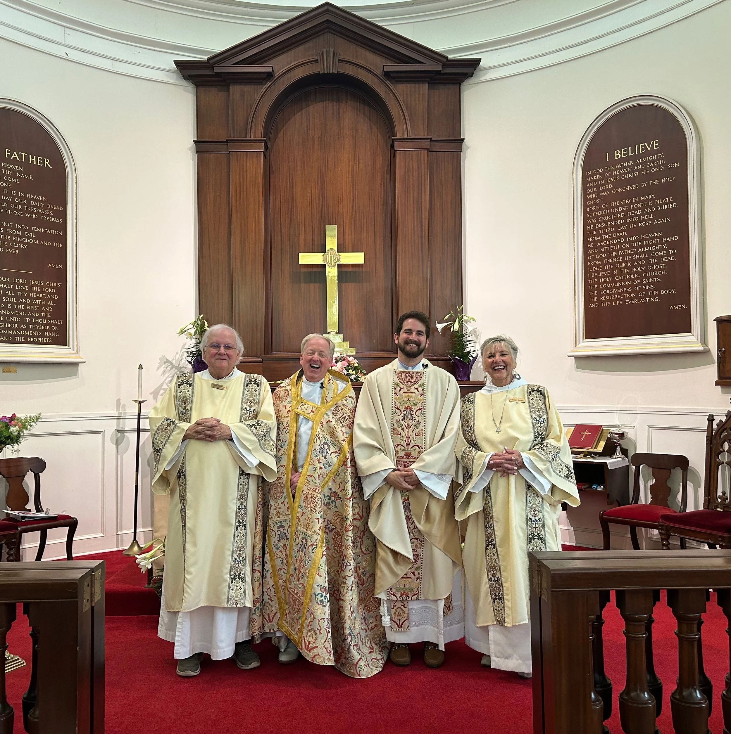 priest shaking hands with parishoner