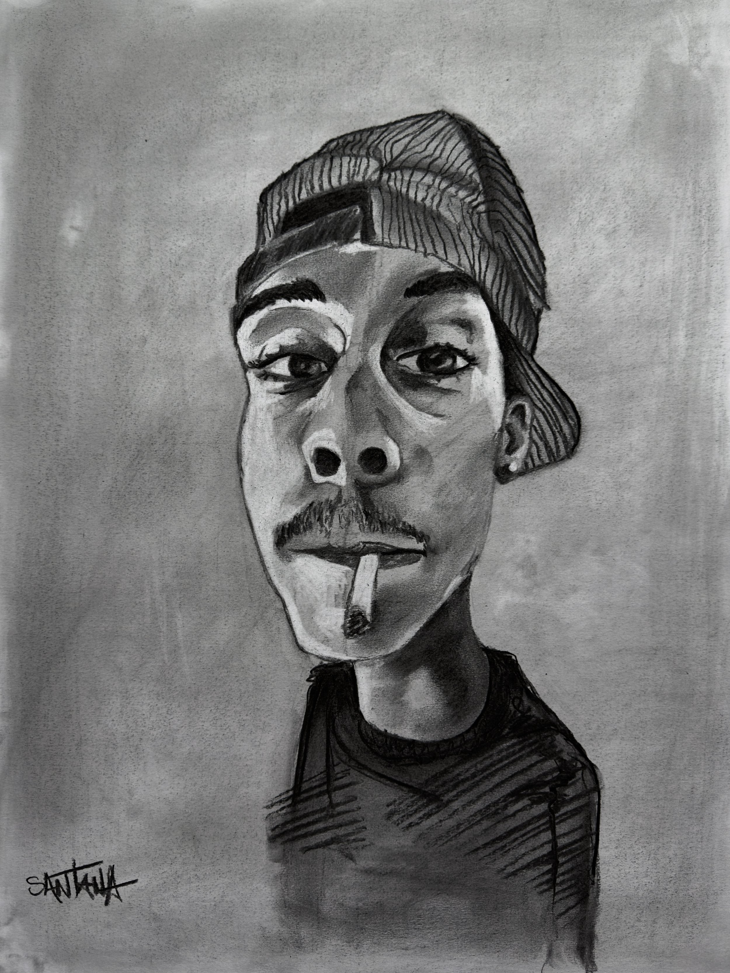 Black and white portrait drawing of a person with a cap worn backwards, smoking a cigarette, with short hair, earrings, and a t-shirt, signed 'SANTALI' in the lower left corner.