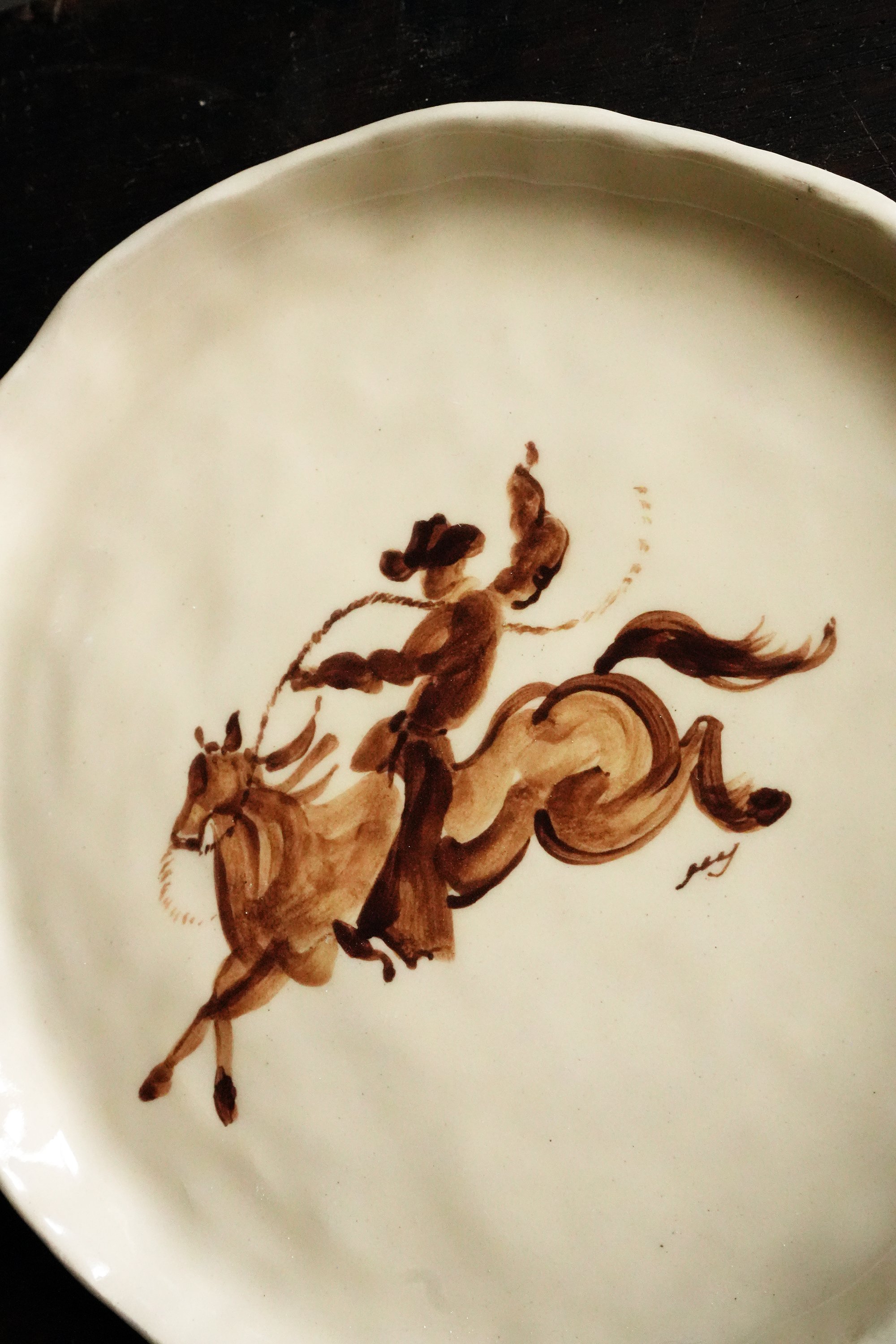 rodeo cowboy standing on horse ceramic plate handpainted handmade ceramics plates tableware dinnerware curiouscommon