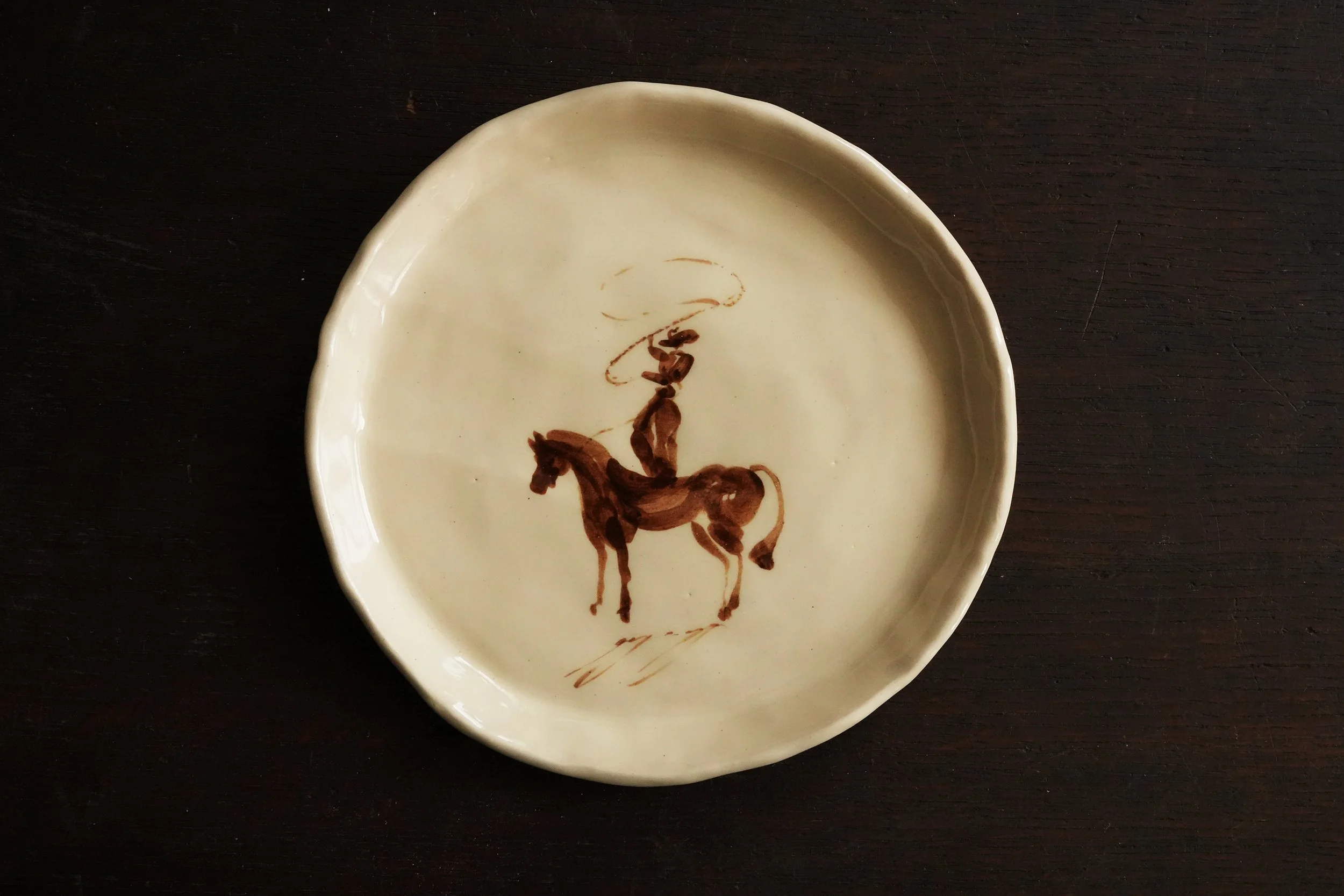 Cowboy Lasso Standing On Horse Plate.JPG