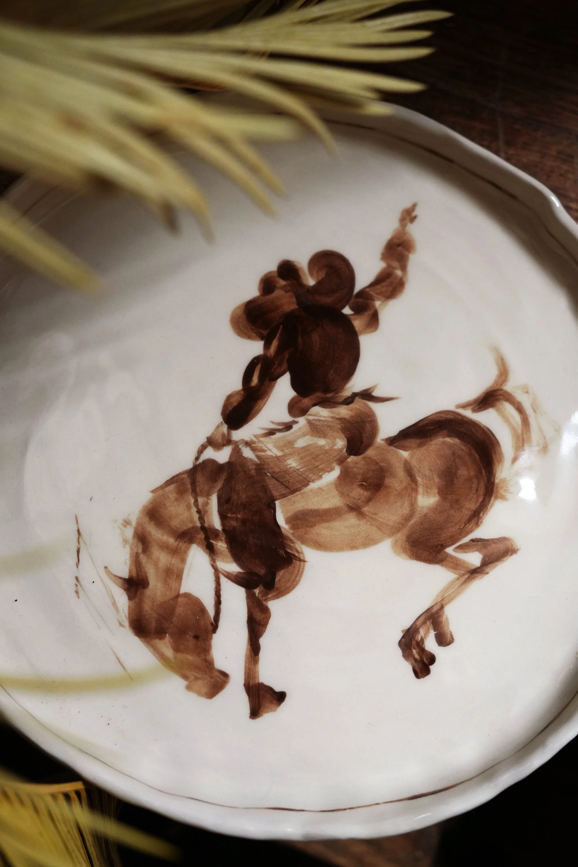 Rodeo Bronc Cowboy Plate by Robyn Yeang.jpg