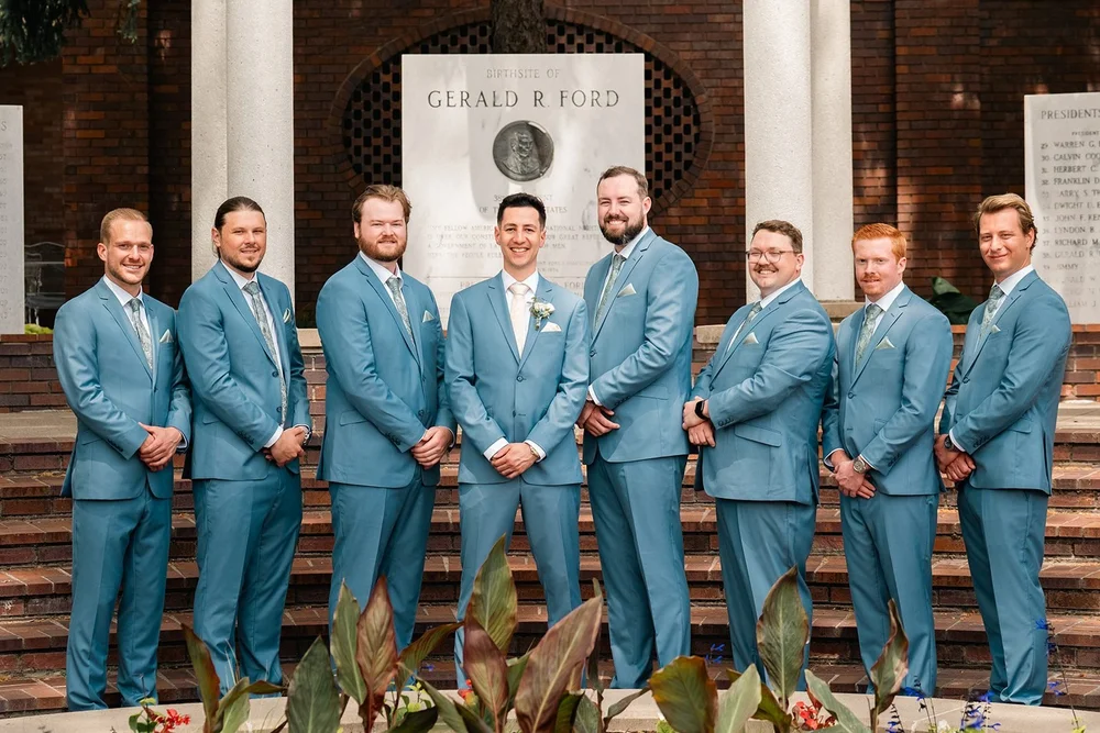 Alex and his groomsmen pose together in the Gerald R. Ford Birthsite gardens