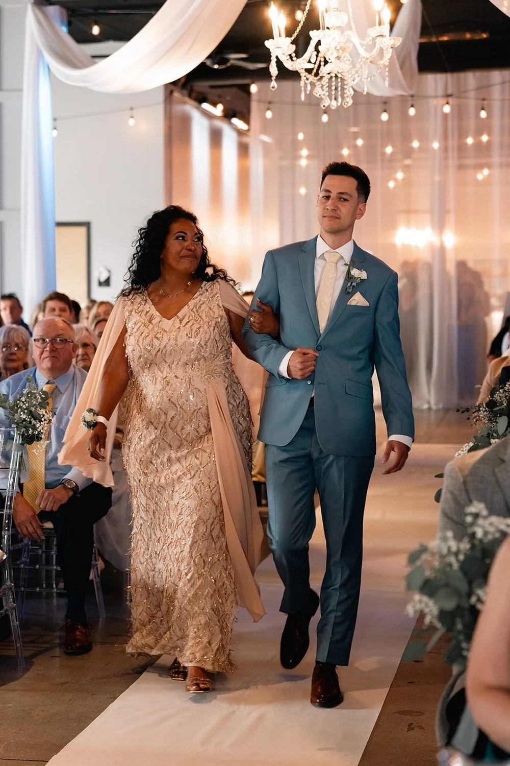 The wedding processional begins inside The Diamond Room in downtown Omaha