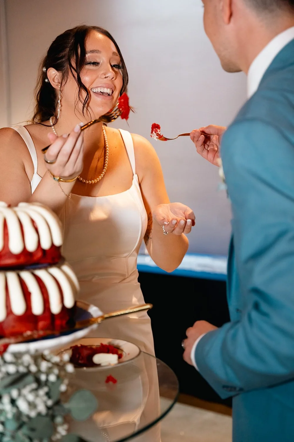Grace and Alex cut their wedding cake during The Diamond Room reception