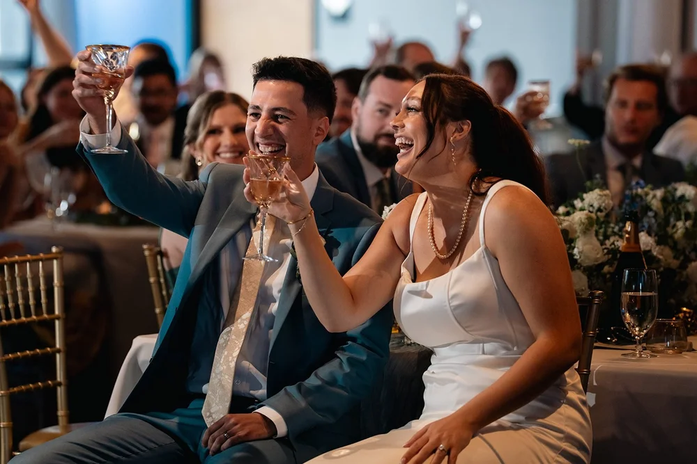 Grace and Alex react to a toast during their downtown Omaha wedding reception