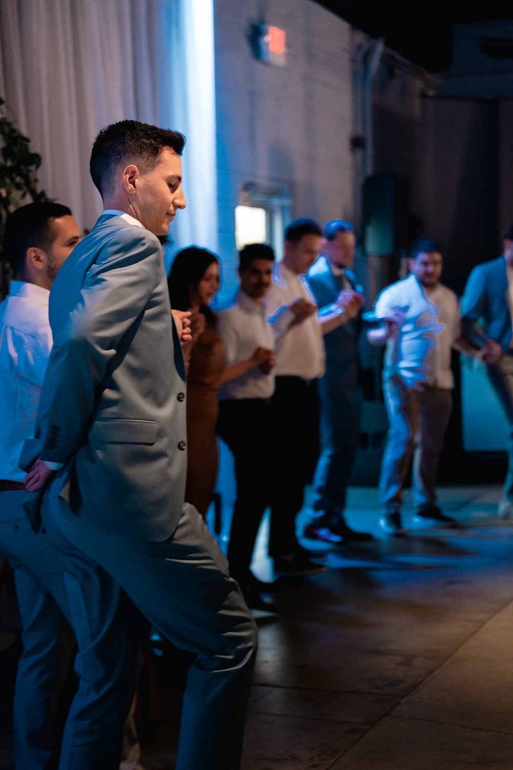 Guests join the Greek wedding dance during Grace and Alex's Diamond Room reception