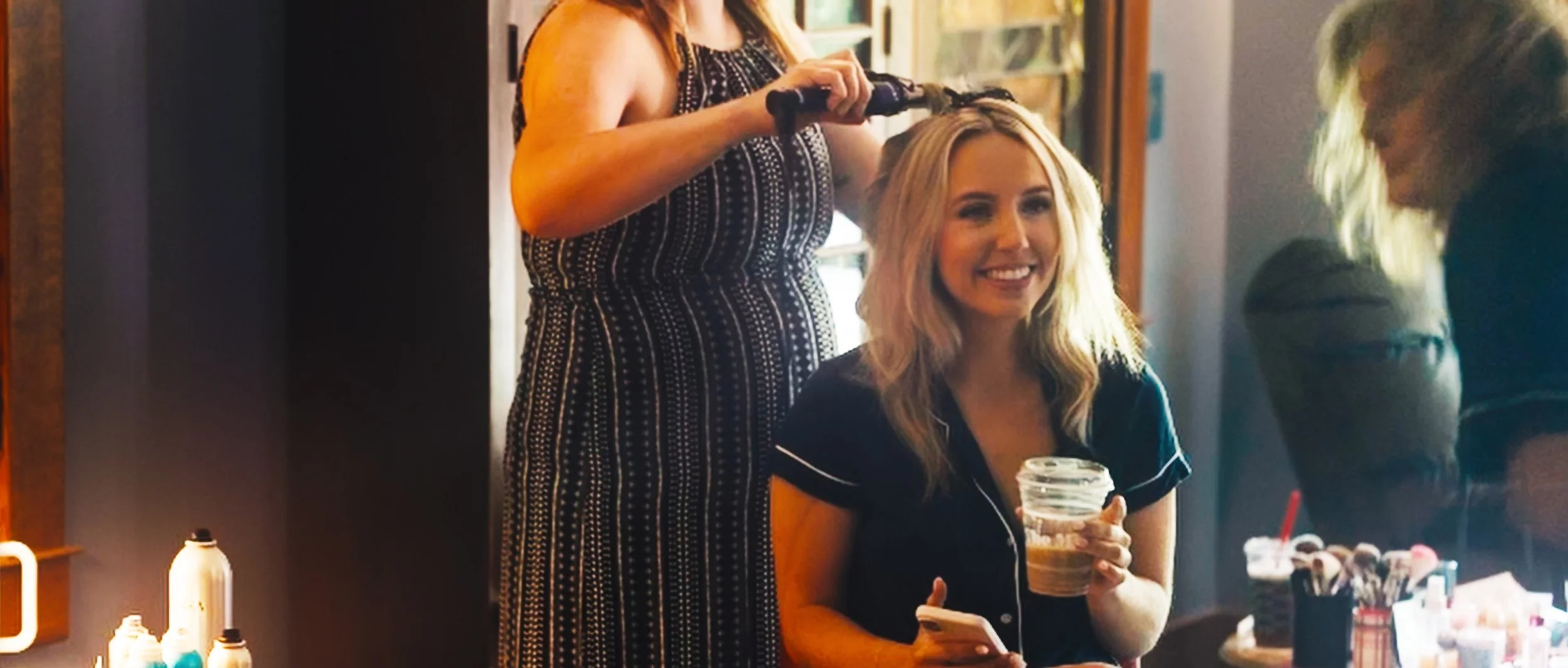  Bridesmaid helping during getting ready at family home wedding in Lincoln Nebraska 