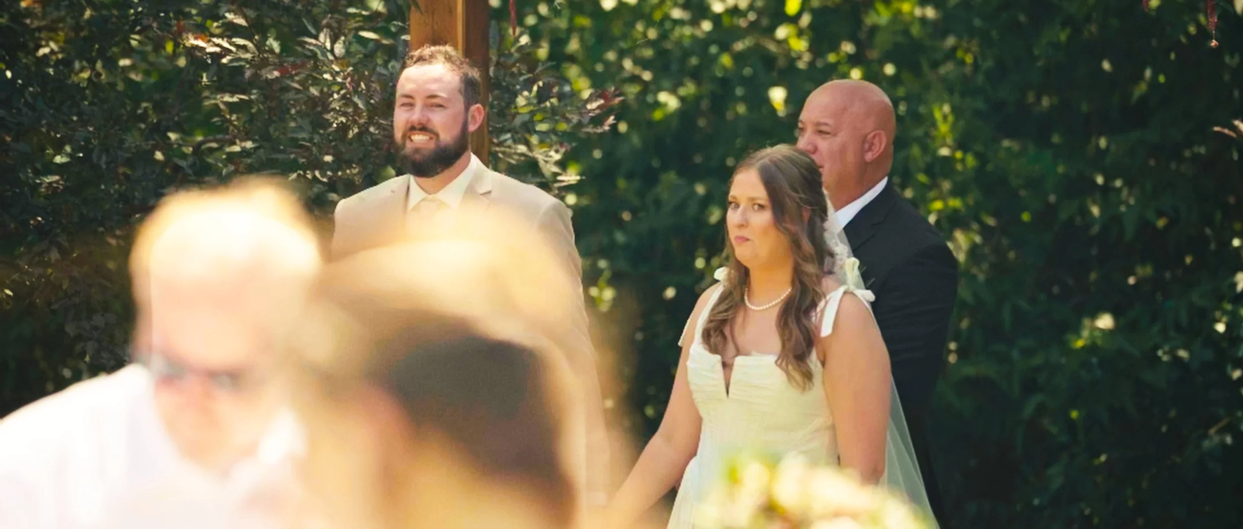 Bride and groom standing together during backyard wedding ceremony in Lincoln Nebraska
