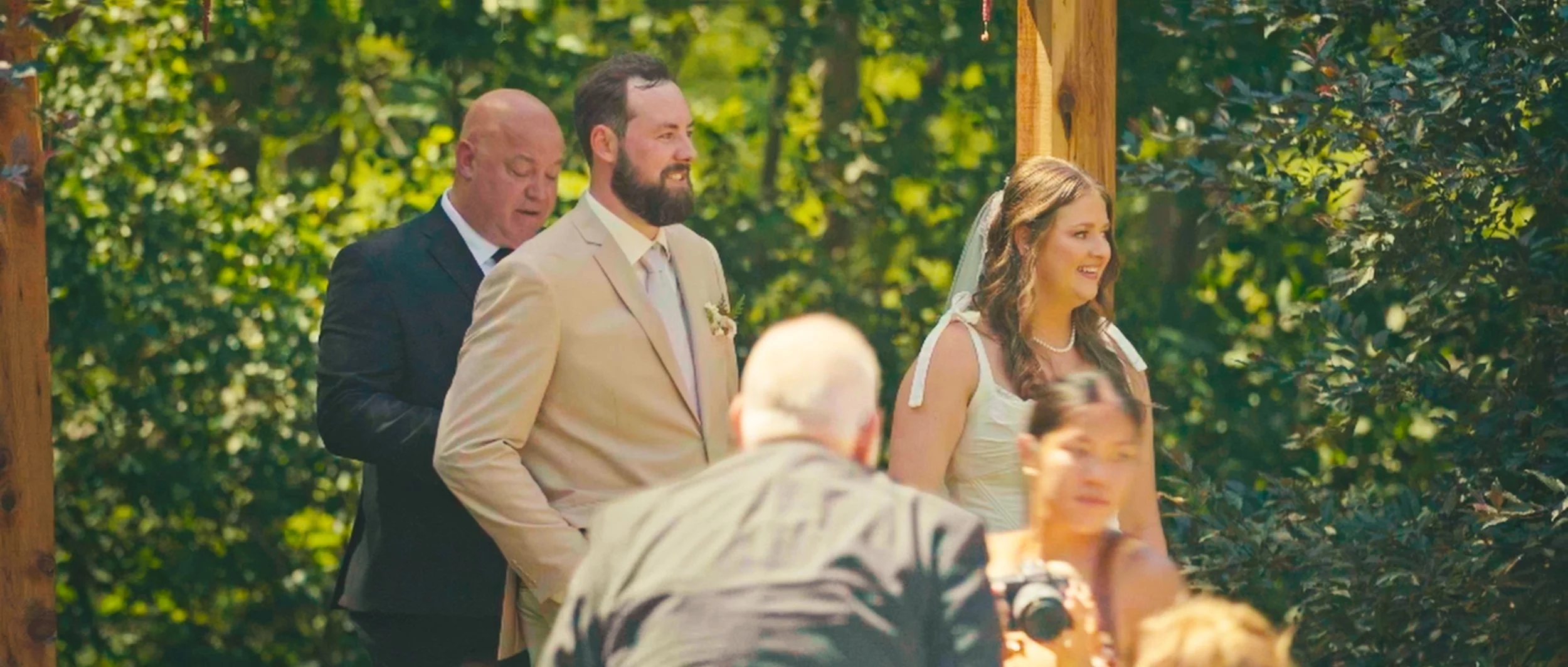 Wedding guests celebrating and cheering during outdoor reception moment in Lincoln Nebraska