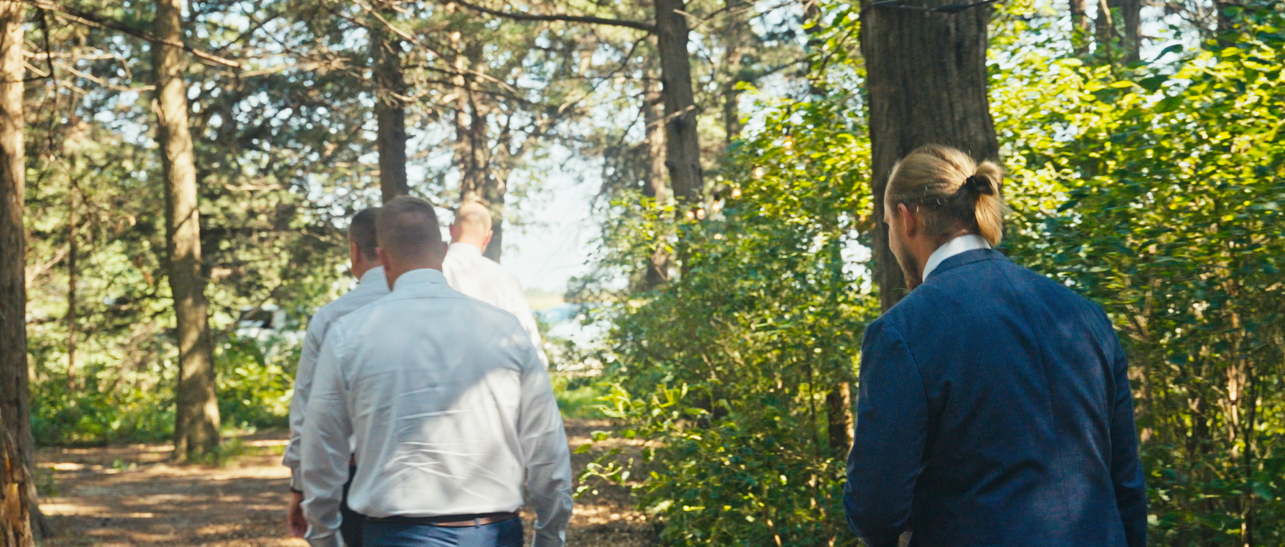 Outdoor Wedding Ceremony Processional Through the Woods in Nebraska