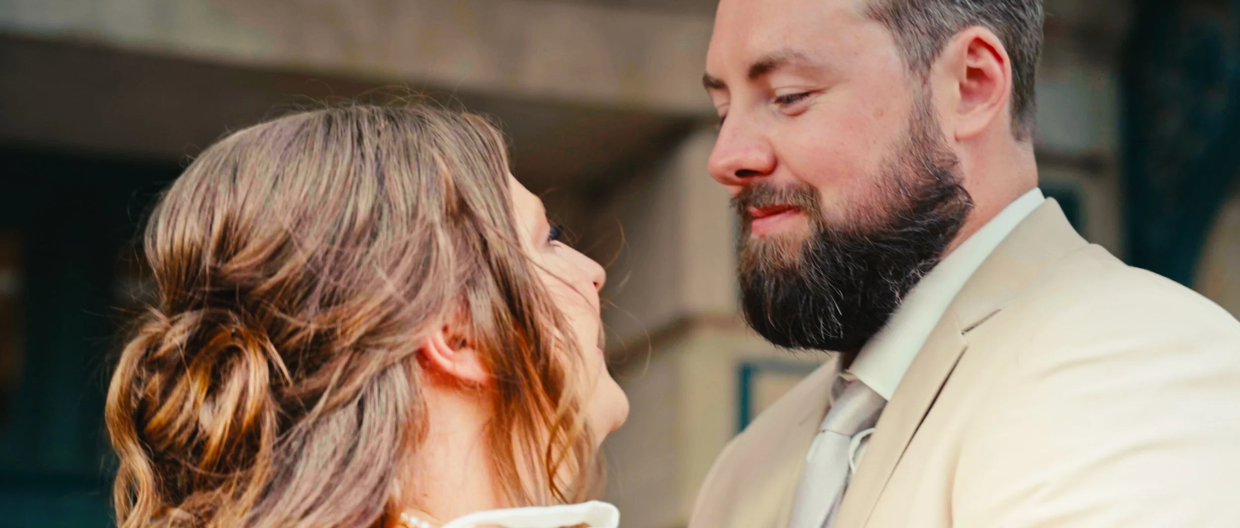 Bride and groom sharing a moment together at Lincoln Station Great Hall wedding in Lincoln Nebraska