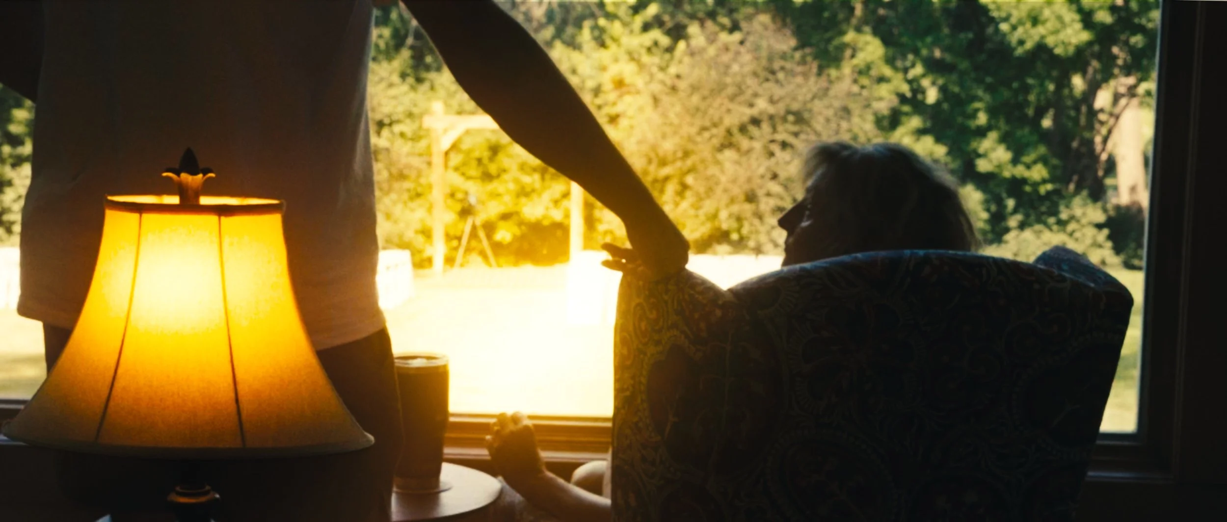 Quiet wedding morning moment inside family home in Lincoln Nebraska with natural window light