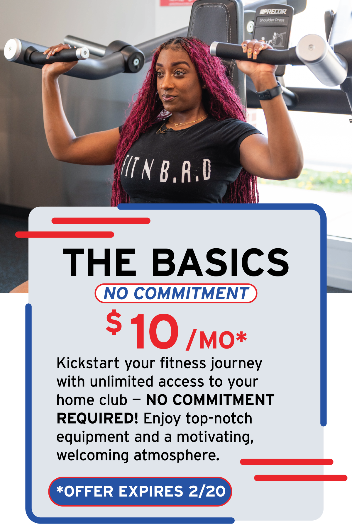 A woman with red braided hair holding a shoulder press machine at a gym, wearing a black T-shirt that reads 'FITNB.R.D'.