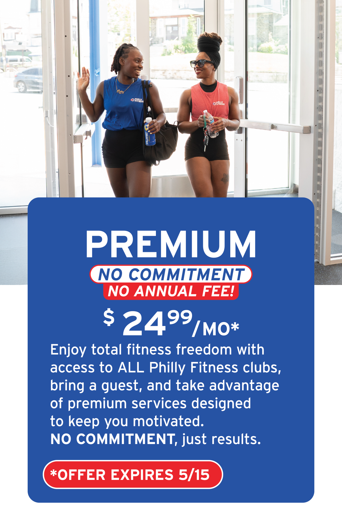 Two women walking into a gym, smiling and chatting, with a promotional sign advertising a fitness membership offer.