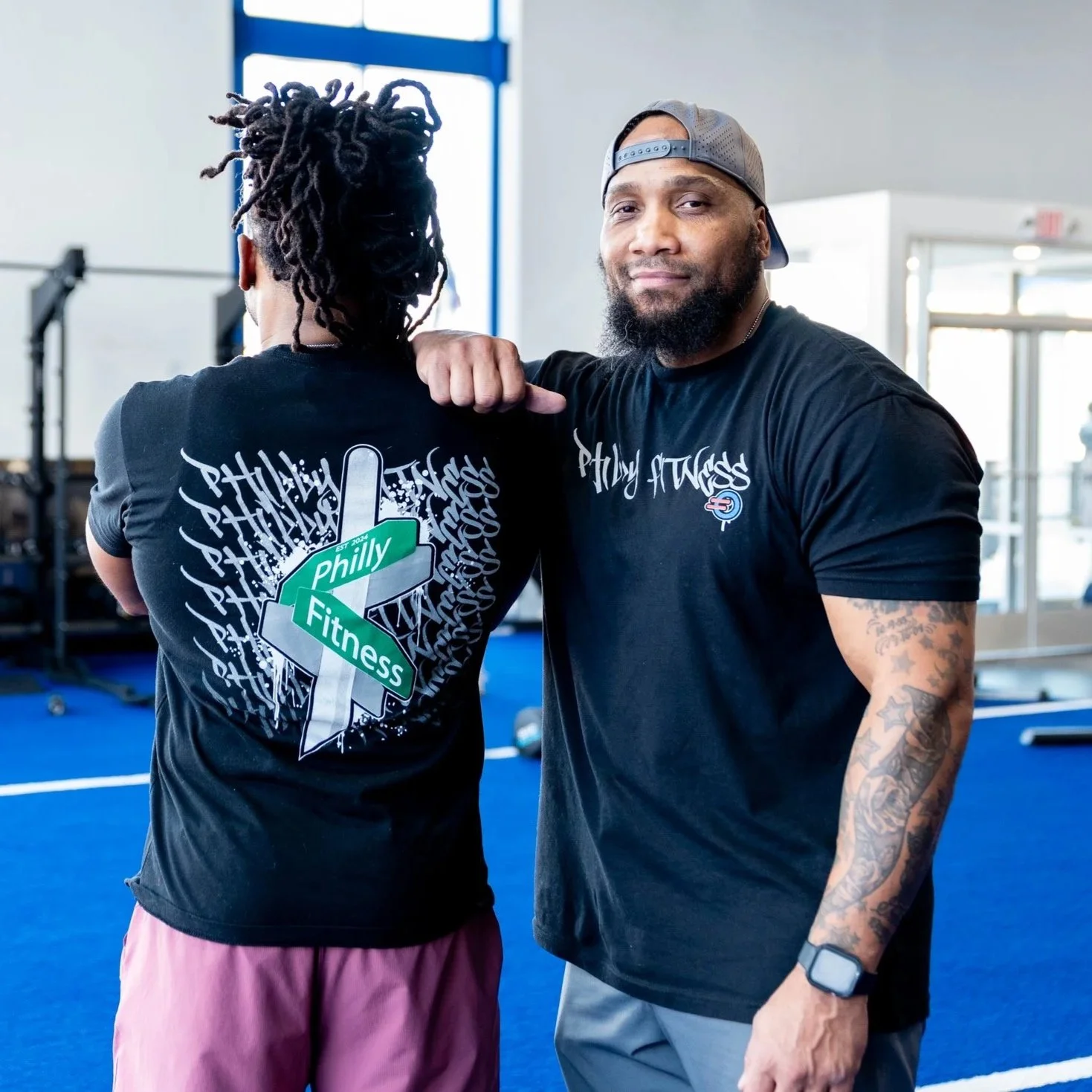 Front and back view of the Philly Fitness® Black Graffiti Street Sign T-Shirt