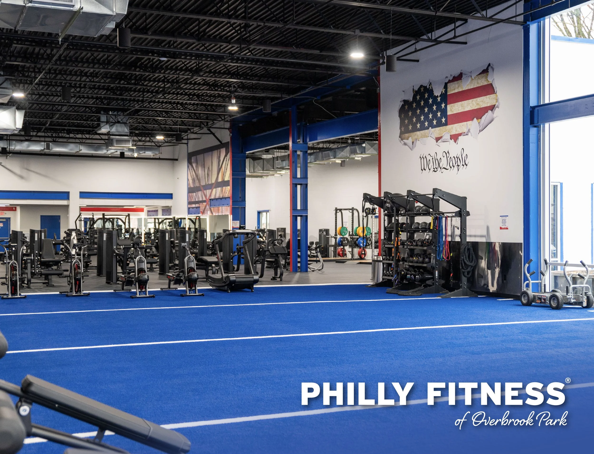 Philly Fitness of Overbrook Park logo in front of photo of various weights and equipment