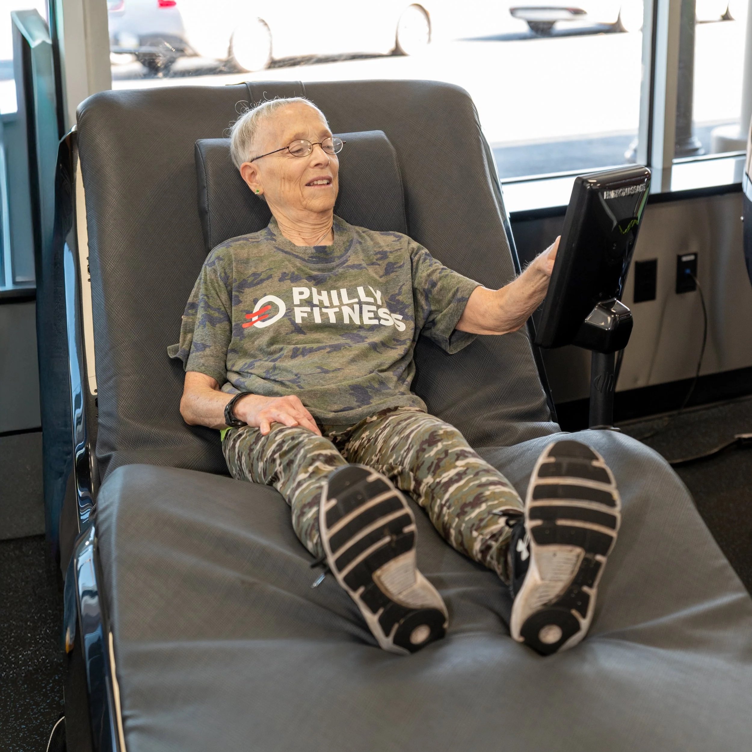 Gym member enjoying the premium amenities while wearing a Camo Philly Fitness® Jersey T-Shirt
