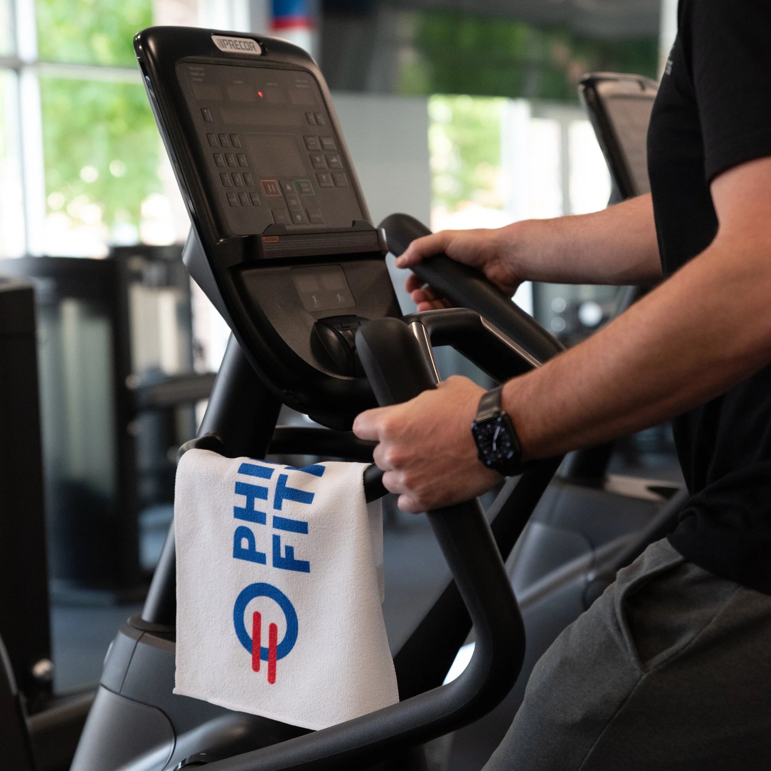 Philly Fitness® Rally Towel being used by gym member on the treadmill