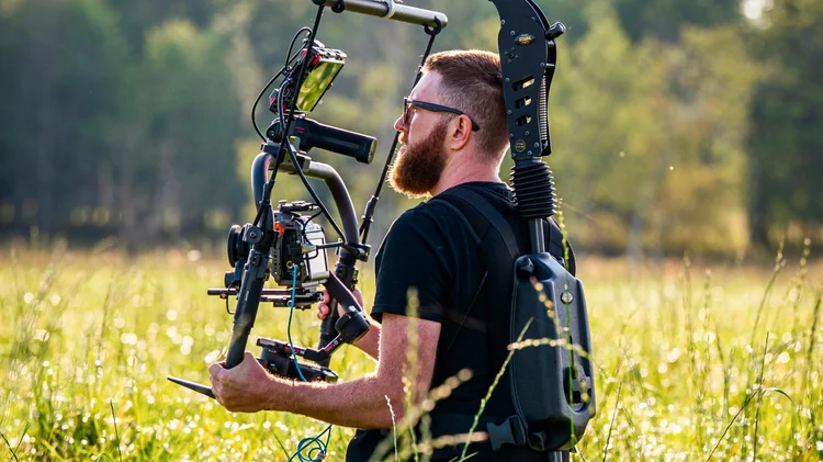 Austin Lysaker operating a stabilized camera rig for DMM Productions