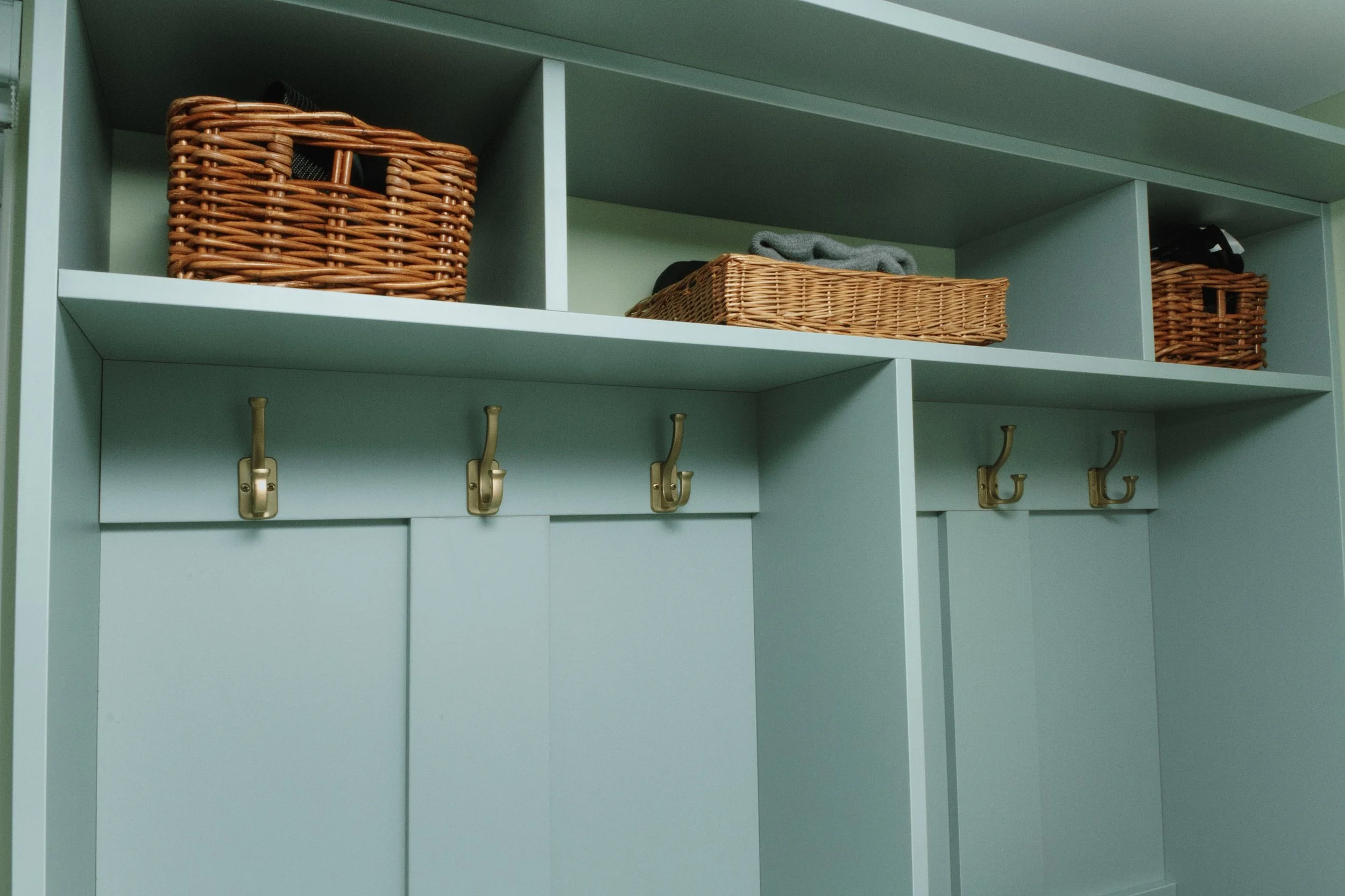 Custom mudroom hook section in green