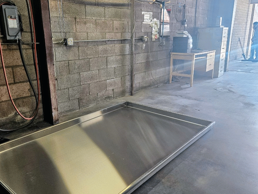 Slideshow of our old vapor degreaser being removed and the new unit being delivered and installed.