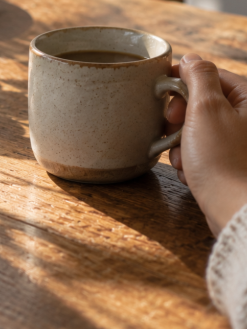Hand with a cup of coffee