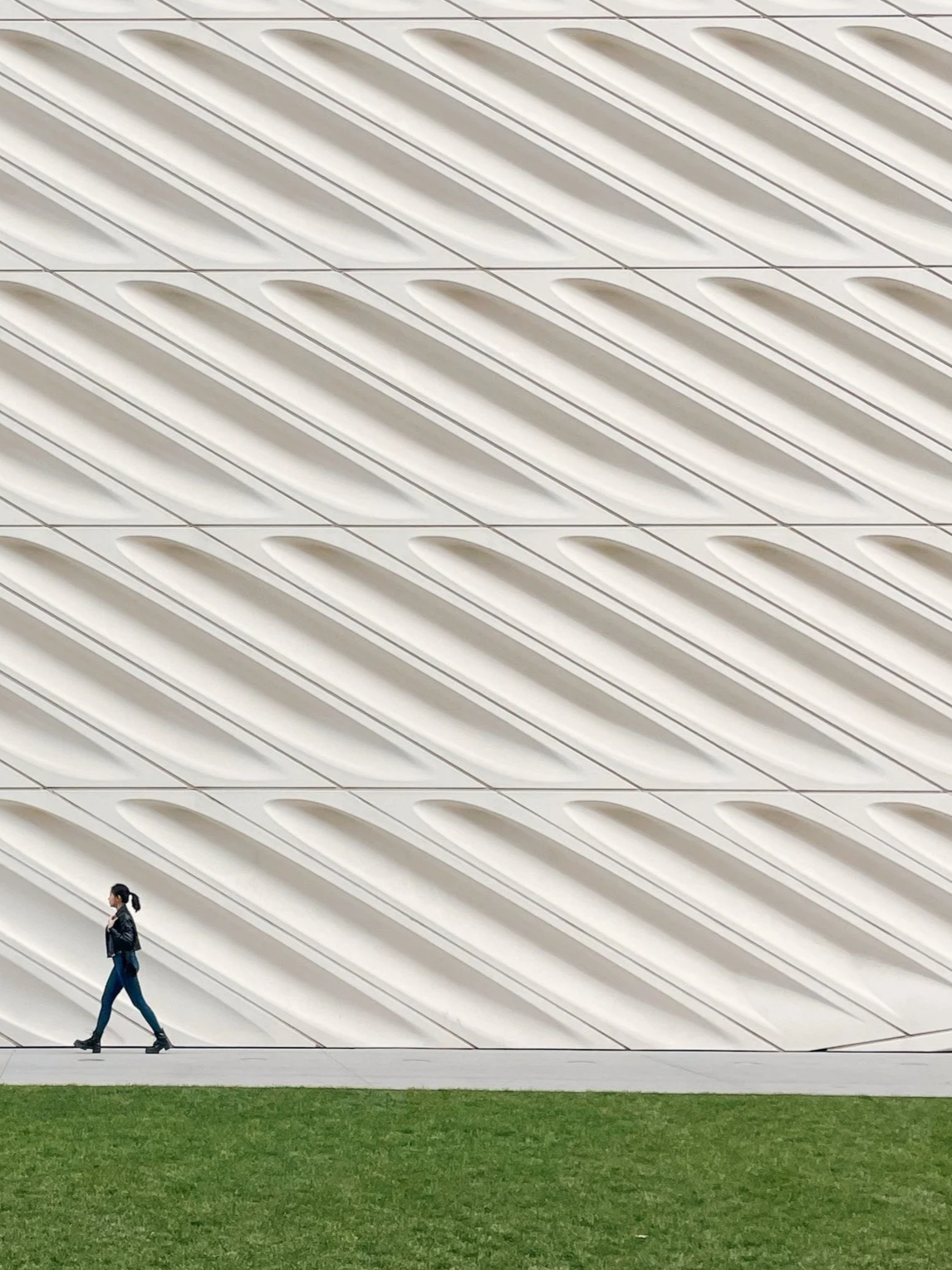 Woman walking outside of the broad museum