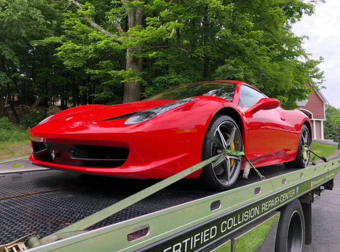 Ferrari 458 on a flatbed tow truck